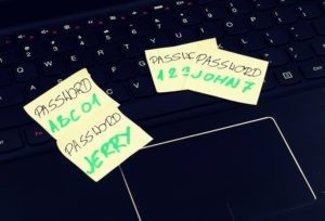 Passwords on Post-its in violation of compliance.